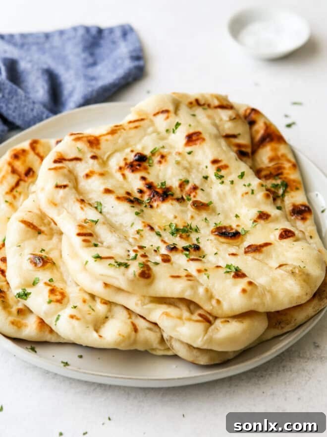 golden-brown grilled flatbread stacked on a rustic plate, ready to be served
