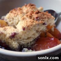 Dutch Oven Huckleberry Peach Cobbler