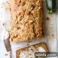 Two favorite quick bread recipes combine into this moist and flavorful banana zucchini walnut bread!