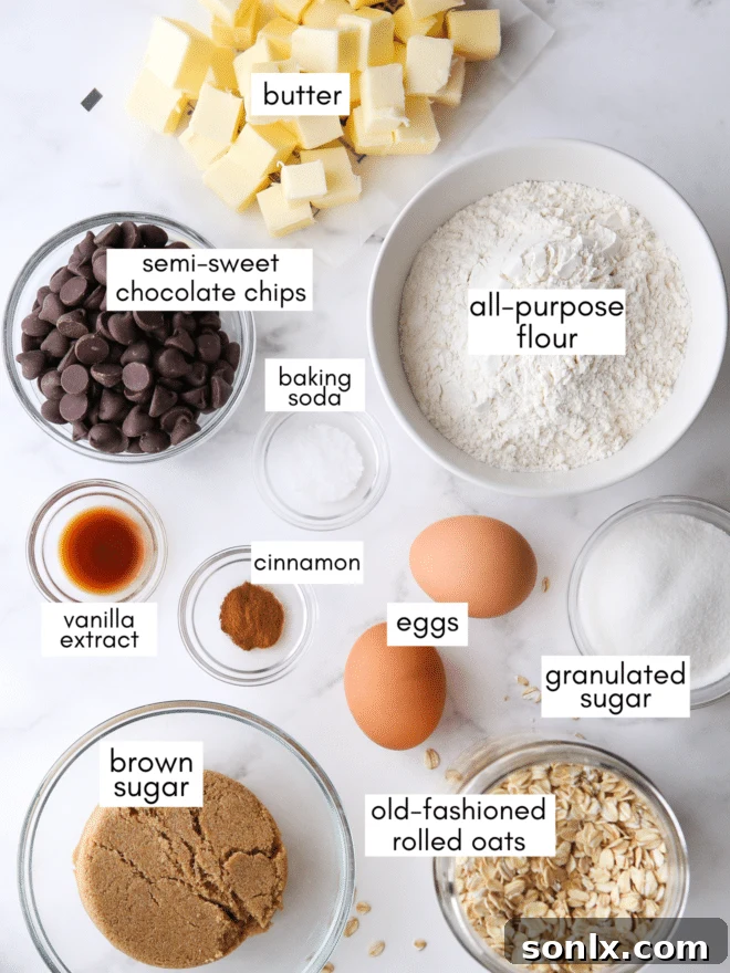 A collection of fresh ingredients laid out, ready for baking Chocolate Chip Oatmeal Cookies.