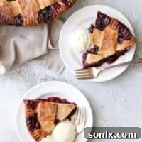 This cranberry blueberry pie is the perfect combination of sweet and tart, with plenty of cozy spices and a buttery flaky pie crust. It's perfect for the holidays!