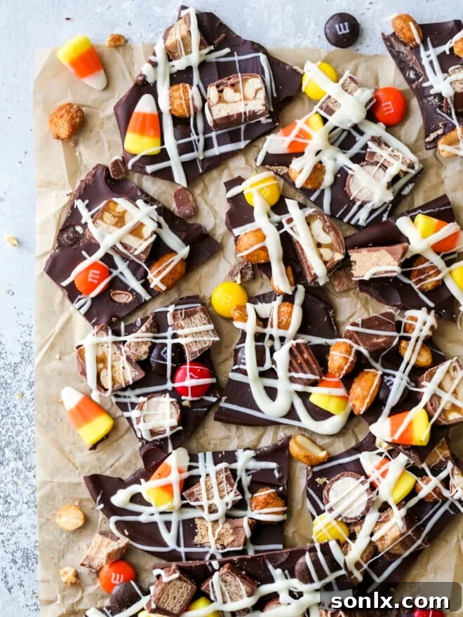 Halloween candy bark broken into pieces, showcasing a variety of colorful candies and chocolate chunks