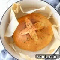 Bake this easy herb bread loaf in your dutch oven for a crispy crust!
