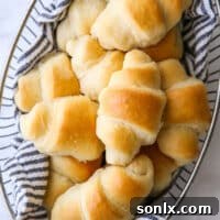 closeup of easy no-knead fairy crescent rolls in a bread basket