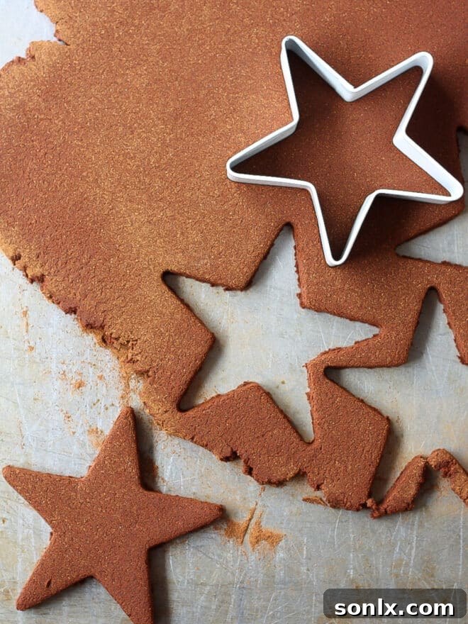 Cutting out cinnamon ornaments into star shapes