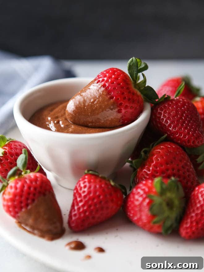 Decadent Chocolate Zabaglione sauce drizzled over fresh berries and ice cream.