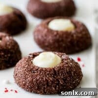 Closeup of beautifully arranged chocolate mint thumbprint cookies on a platter, ready to be enjoyed