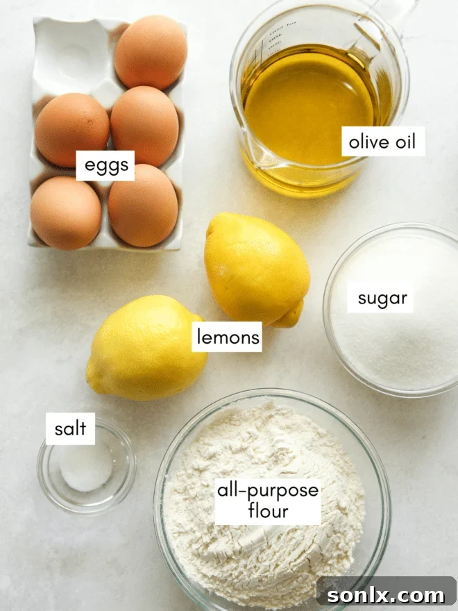 A flat lay photograph showcasing all the fresh ingredients needed for a lemon olive oil cake, including bright yellow lemons, eggs, all-purpose flour, granulated sugar, salt, and a bottle of high-quality extra-virgin olive oil.