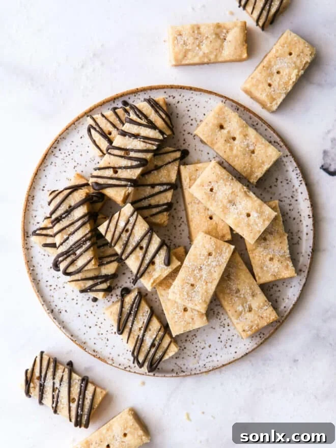 overhead view of brown butter shortbread cookies on a plate, showcasing their golden hue and perfect texture