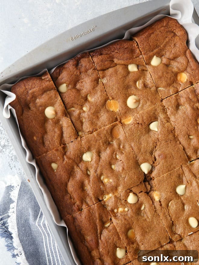 Close-up of sliced gingerbread white chocolate blondies ready to serve.