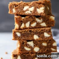 These blondies are filled with molasses, white chocolate chips and scented with warm spices like cinnamon, cloves, and ginger.