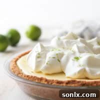 This light and creamy tequila lime pie is light, creamy, and has a bit of a fun kick!