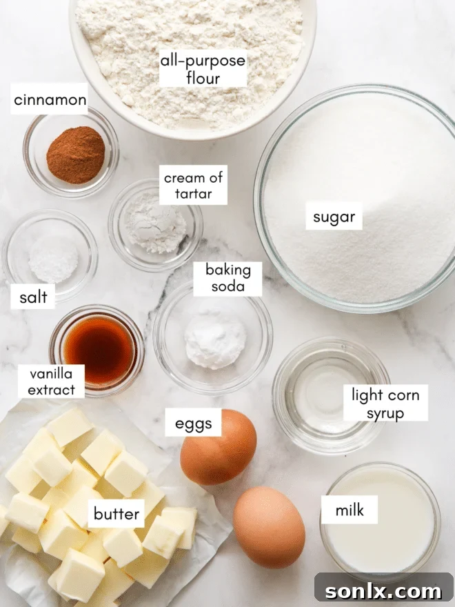 A well-organized display of all necessary ingredients for cinnamon gooey butter bars, including butter, sugar, flour, eggs, milk, and cinnamon, ready for baking.
