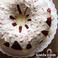 Featured image for Cheesecake Stuffed Peppermint Red Velvet Bundt Cake recipe