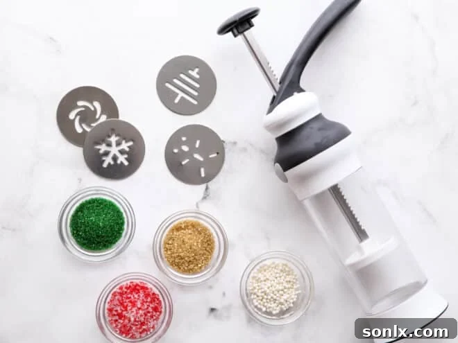 A close-up view of a cookie press with dough inside, ready to create festive shapes.