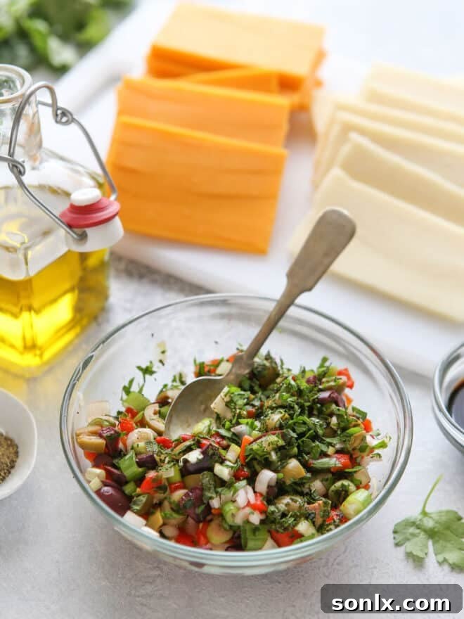 Assorted cheeses being prepared for marination.