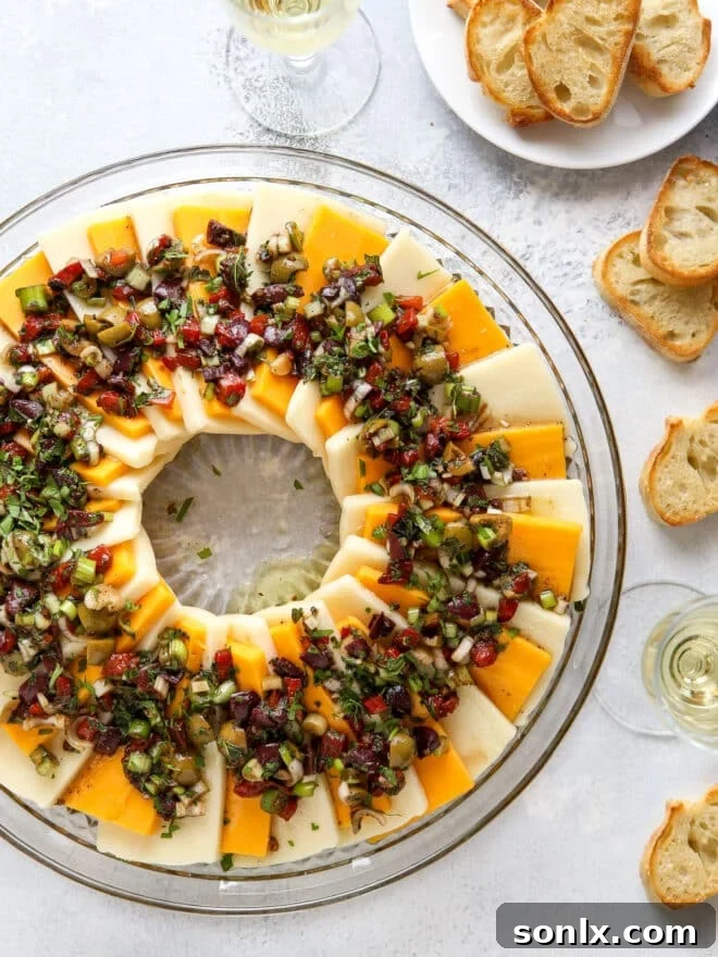 Marinated cheese wreath on a serving platter, ready to be served.