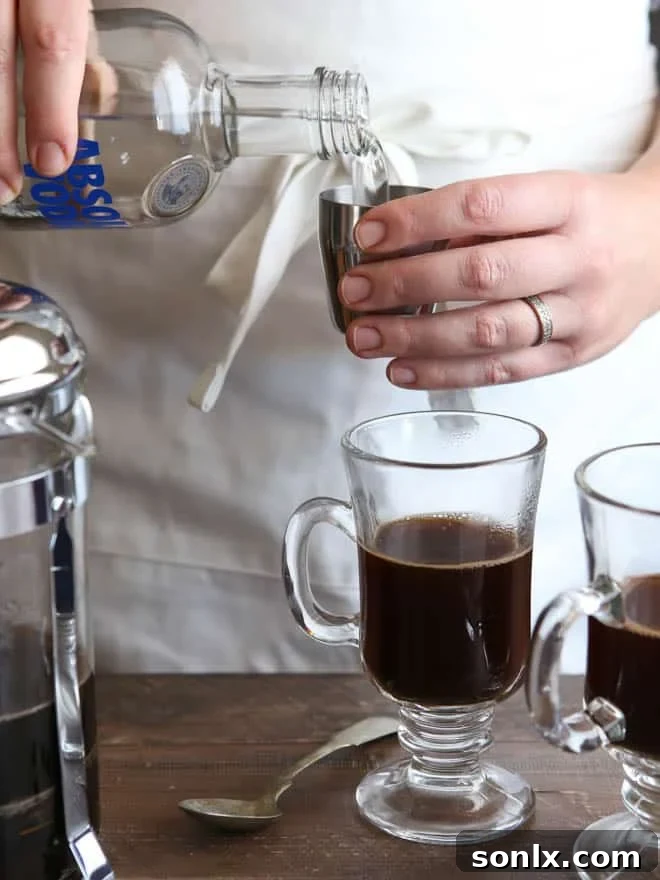 Adding freshly brewed coffee to a mug, the first step for a White Russian Mocha.