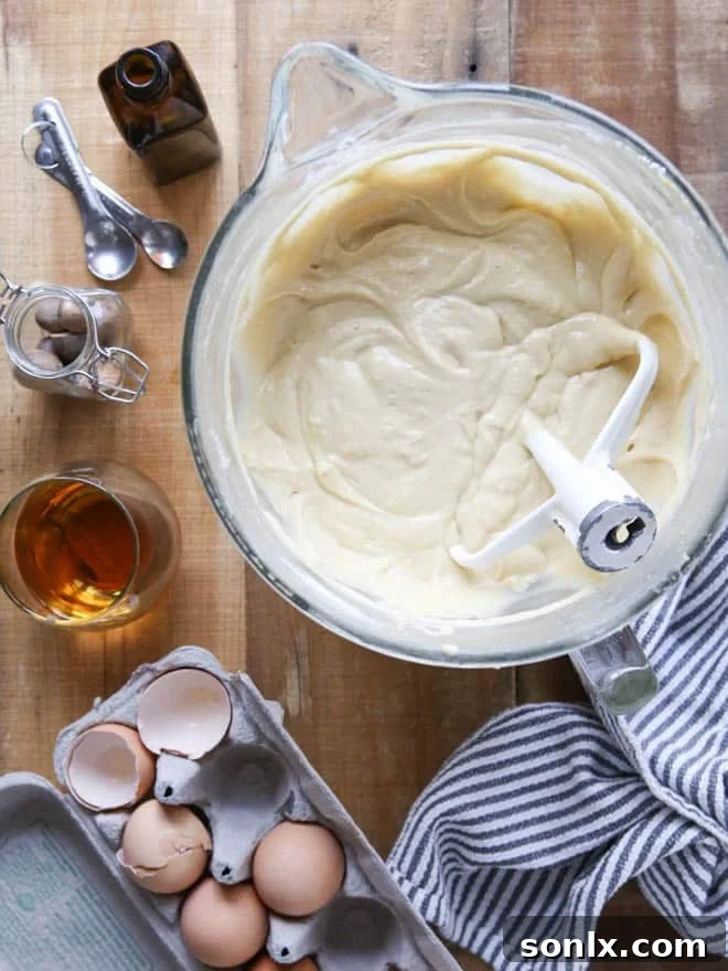 Slice of Bourbon Butterscotch Cake showing moist layers and creamy frosting.