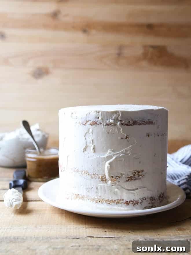 Beautifully frosted Bourbon Butterscotch Cake, ready for slicing.