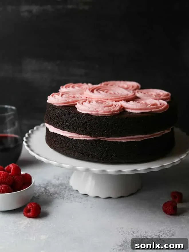 Decadent Red Wine Chocolate Cake with Fresh Raspberry Buttercream by completelydelicious.com