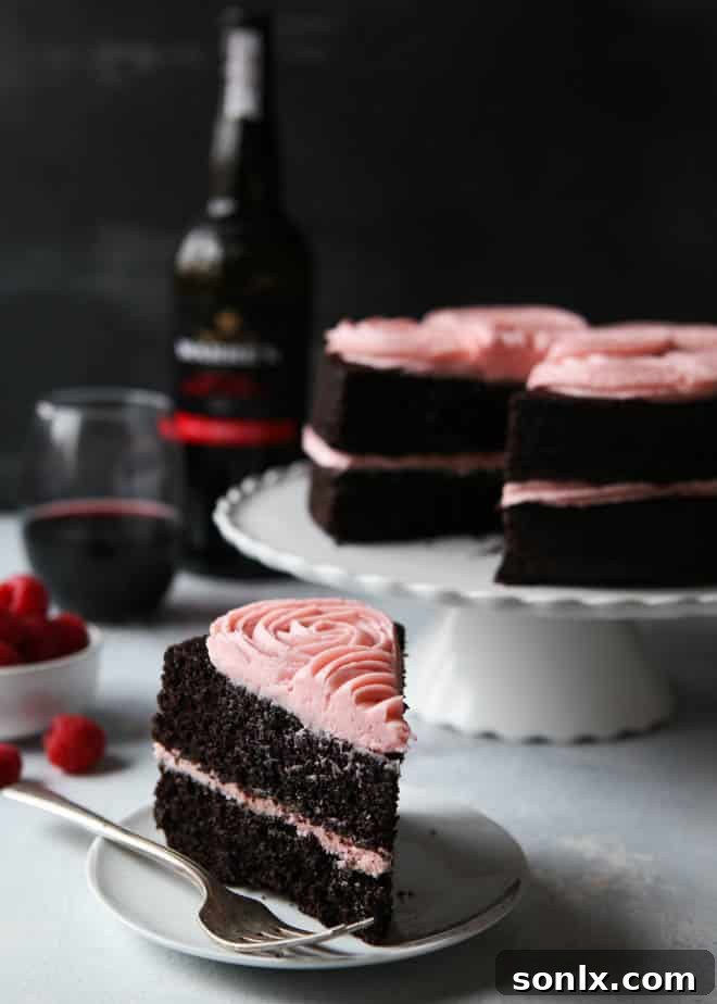 Slice of Red Wine Chocolate Cake with Raspberry Buttercream on a plate