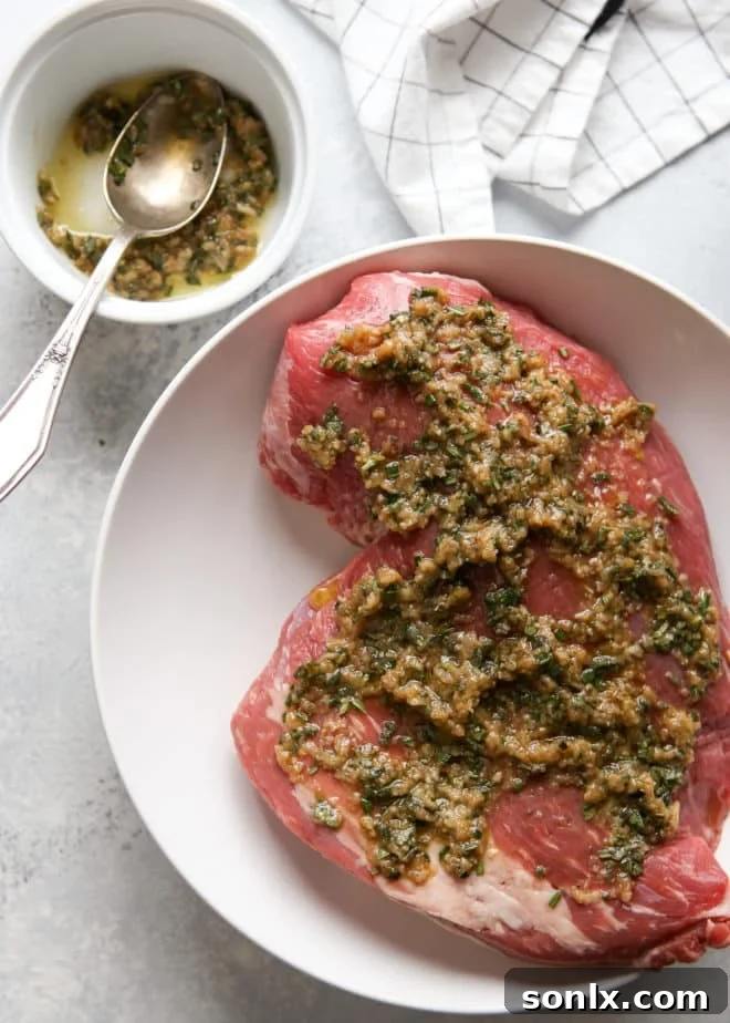 marinating tri-tip roast with garlic and herbs