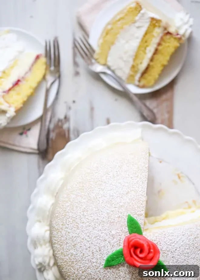 Princess Cake slice showing distinct layers of sponge, jam, custard, and cream, all under marzipan