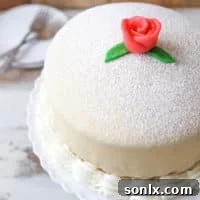 Princess Cake - sponge cake with vanilla and raspberry filling covered with marzipan | completelydelicious.com