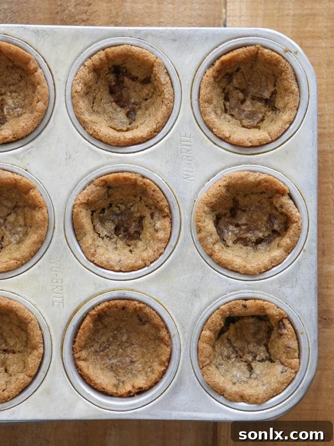 A trio of Chocolate Chip Cookie Cups, beautifully crafted and waiting for their decadent cookie dough frosting filling, showcasing their perfect cup shape.