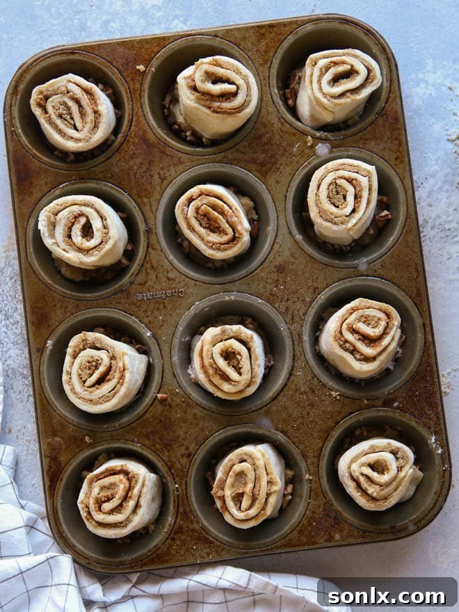Puff Pastry Sticky Buns cooling on a wire rack, drizzled with extra caramel