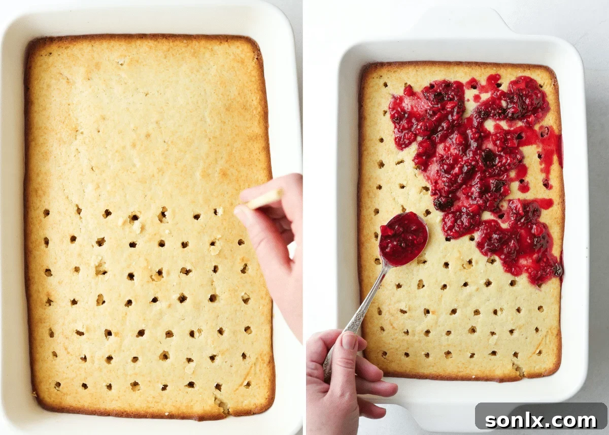 Poking holes in a warm cake and spooning berry filling over it