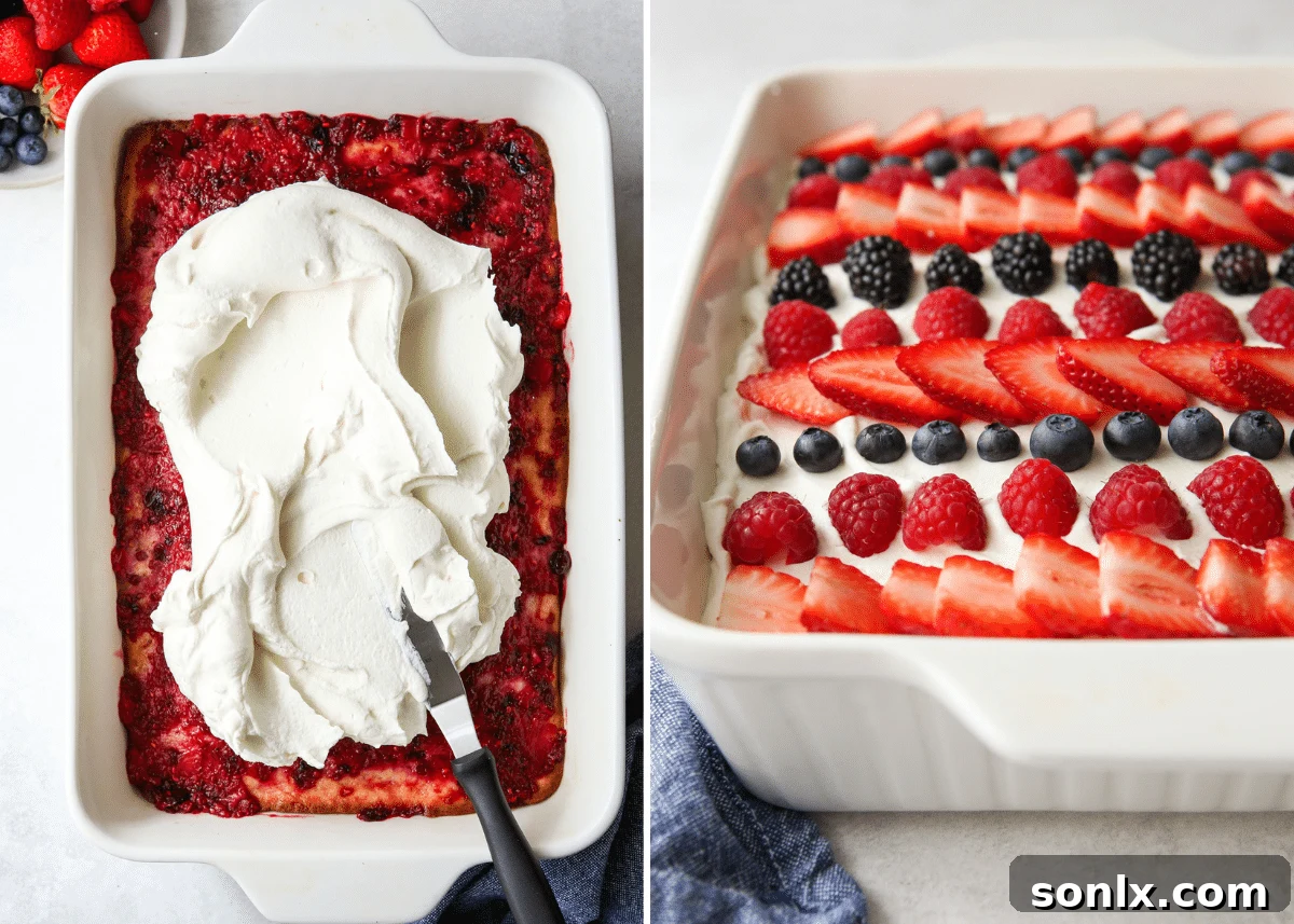 Chilled berry poke cake topped with whipped cream and garnished with fresh berries