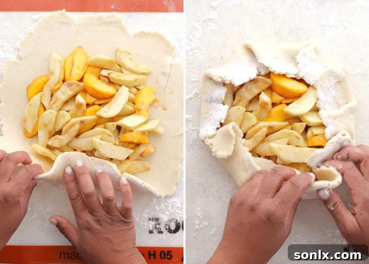 Rustic Orchard Peach Apple Galette 7 Hands folding the edges of pie crust over a peach and apple filling, creating a rustic galette shape