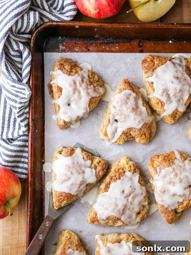 iced apple cinnamon scones on a sheet pan