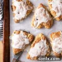 iced apple cinnamon scones on a sheet pan