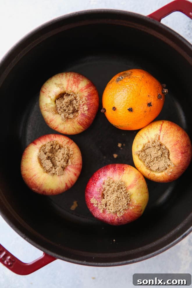 Close-up of baked apples in a pot, ready for the wassail mixture.