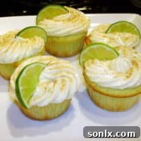 Delicious Key Lime Cupcakes with cream cheese frosting and lime wedge garnish