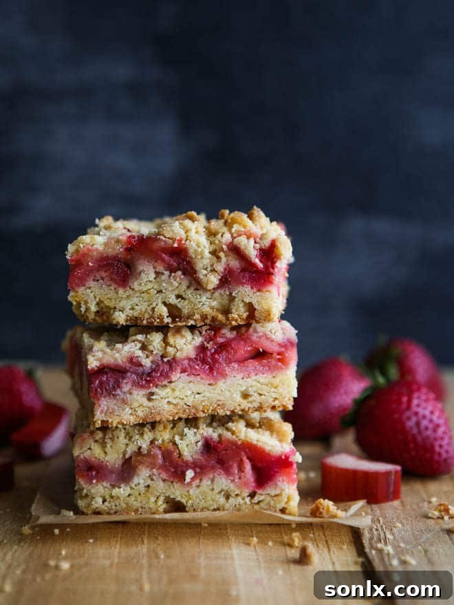 Delicious strawberry rhubarb crumb bars perfect for spring and summer desserts