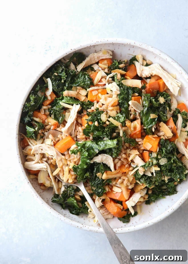 This farro bowl with chicken, kale and sweet potatoes is one of my favorite healthy meals! Enjoy this nutritious and delicious recipe year-round for lunch or dinner.