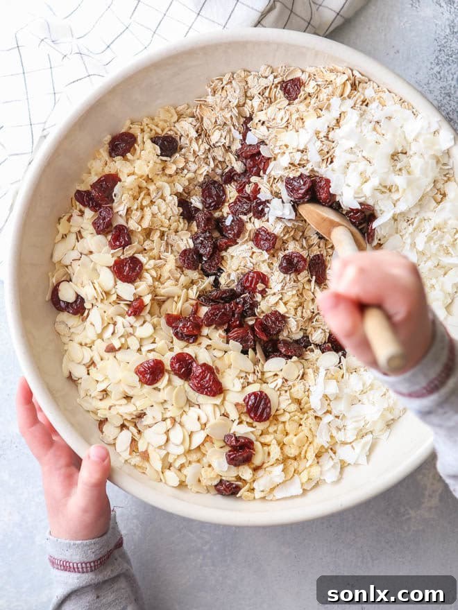 Close-up of healthy no-bake cereal bars showing texture and ingredients like cherries and almonds