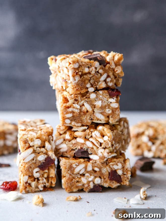 No-bake cereal bars with dried cherries, almonds, and coconut displayed in a serving dish