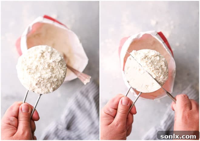 A measuring cup overflowing with flour, demonstrating the proper spoon-and-level technique with a knife to ensure accurate measurement