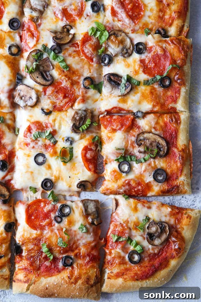 Sheet Pan Pizza with Pepperoni, Olives, and Mushrooms