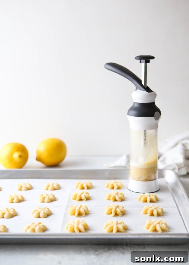 Lemon spritz cookies made with a cookie press