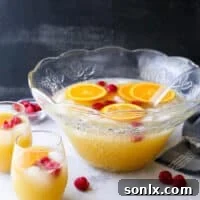 Mimosa Punch in a punch bowl with a recipe card icon
