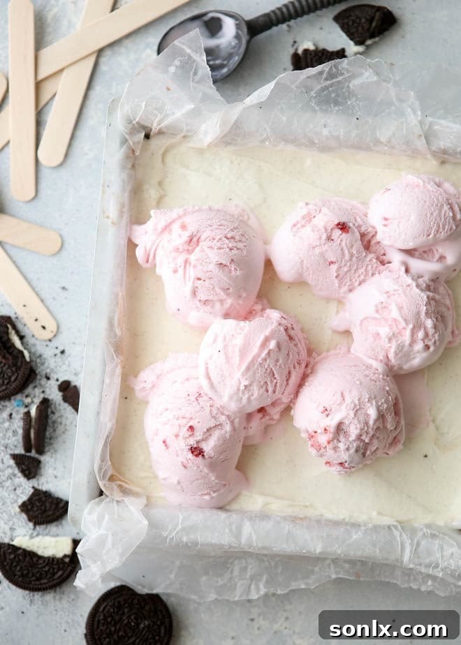 Close-up of Neapolitan Ice Cream Pops showcasing the distinct layers of Oreo crust, chocolate, vanilla, and strawberry ice cream
