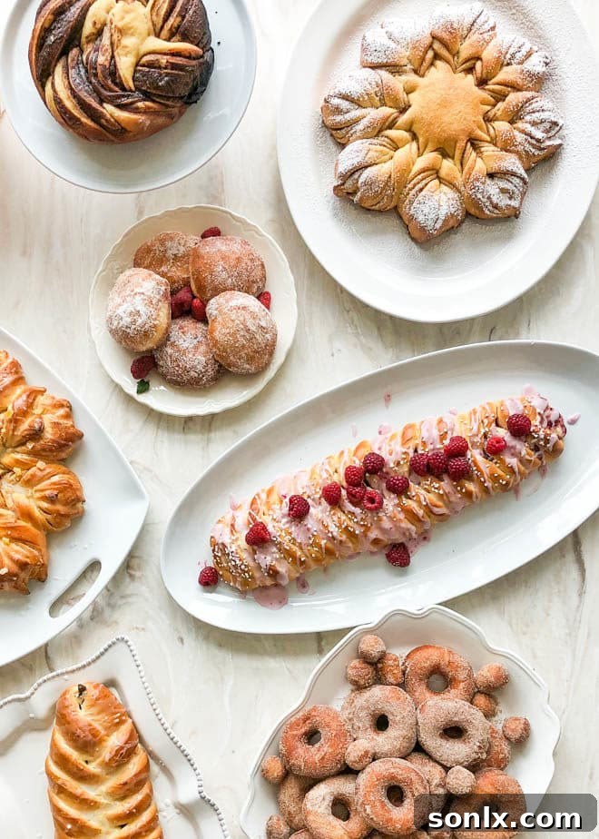 An impressive table laden with a variety of freshly baked breads and pastries, all made during the baking workshop.