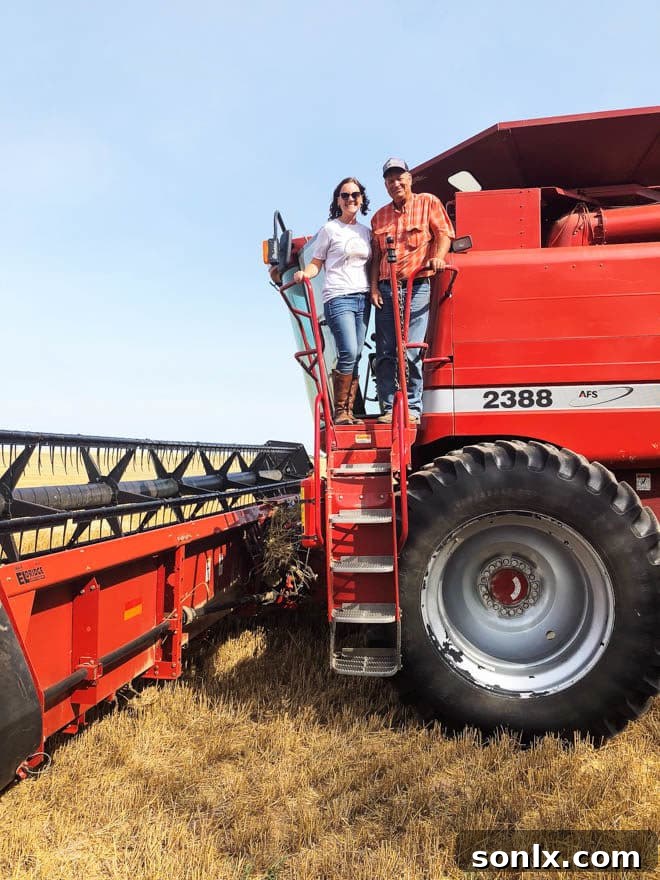 Blogger posing with Kansas wheat farmer Scott Van Allen in a wheat field.