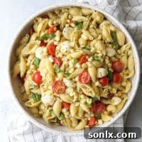 This fresh corn, tomatoes, pesto and mozzarella salad is perfect for summer!